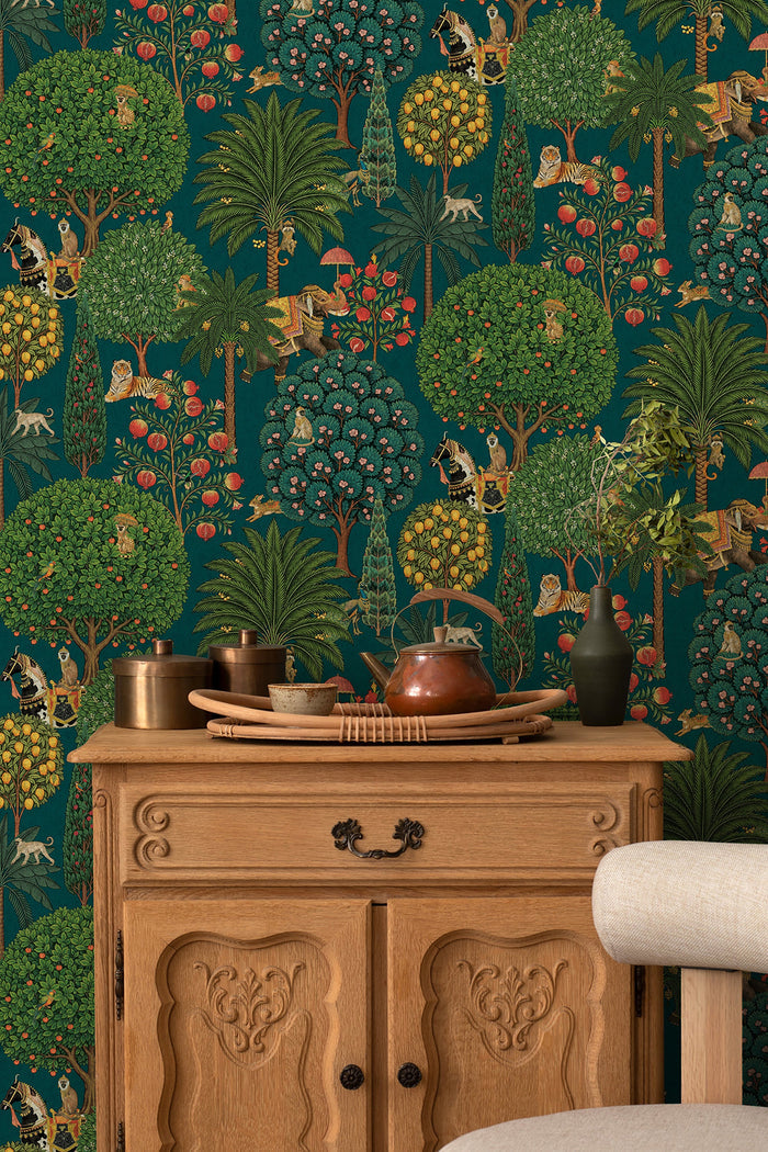 Bengal wallpaper in Teal on a feature wall, jewelled animal motifs among leaves