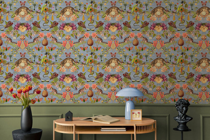 Bohème wallpaper in Sky Blue on a feature wall, showing the mirrored curiosity-cabinet pattern