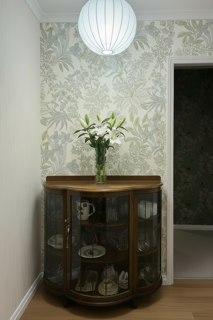 Room with subtle blue lampshade and bloomed lilies
