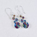 Colorful geometric crystal round earrings by Mosaico Jewels featuring a bold design with multi-colored stones.