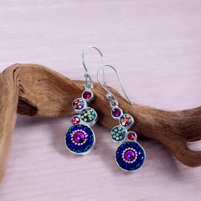 Stylish geometric crystal round earrings by Mosaico Jewels with vibrant blue and pink hues, perfect for accessorizing.