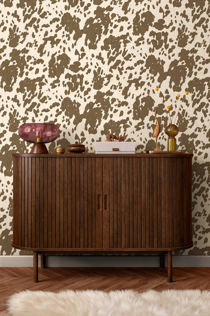 Holstein wallpaper in Cocoa on a feature wall, cowhide-pattern detail