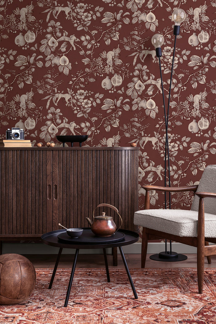 Liana wallpaper in Maroon on a feature wall, leopards and pomegranates in fine linework