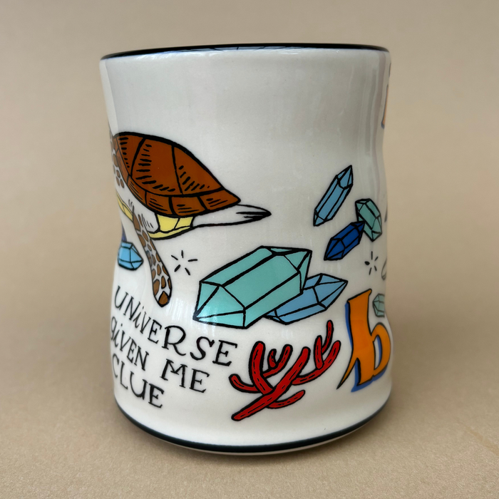 Side view of the Lucky Sea Turtle Cup - XLarge showcasing a turtle and crystal design with the phrase 'the universe has given me a clue.' Created by The Bowl Maker.