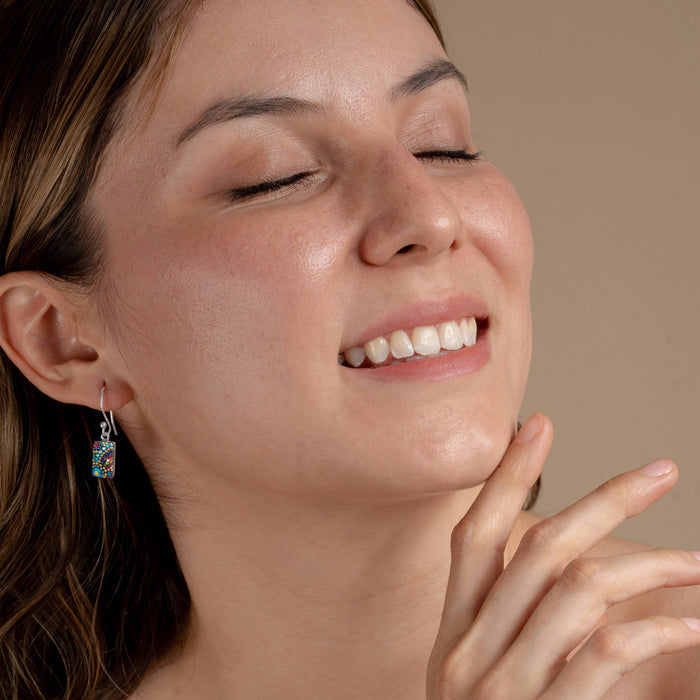 Model wearing Petite Crystal Spark Earrings from Mosaico Jewels, highlighting the earrings' colorful sparkle and lightweight design for everyday wear.