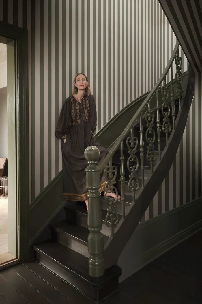 Sam Narrow Striped wallpaper in Forest Green in a room setting